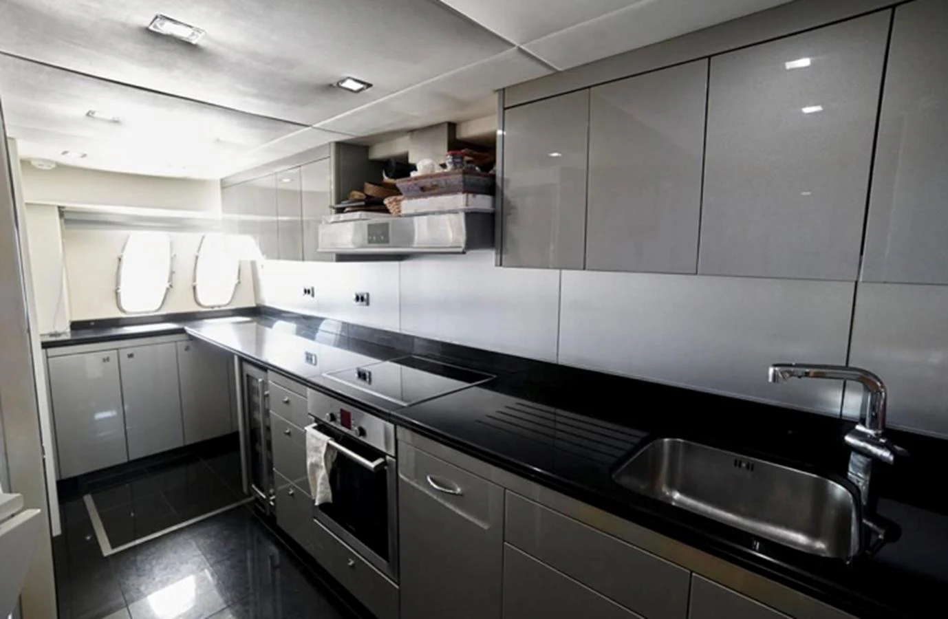 a kitchen with stainless steel appliances aboard NOVA 92 Yacht for Sale