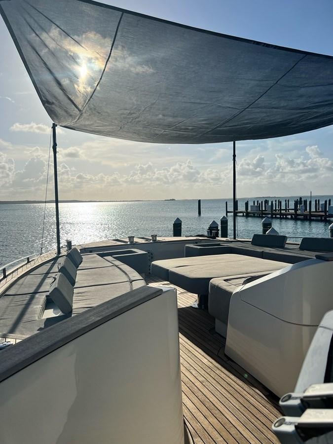 a deck with a view of the ocean and a large building aboard NEVER SAY NEVER 2015/2023 Yacht for Sale