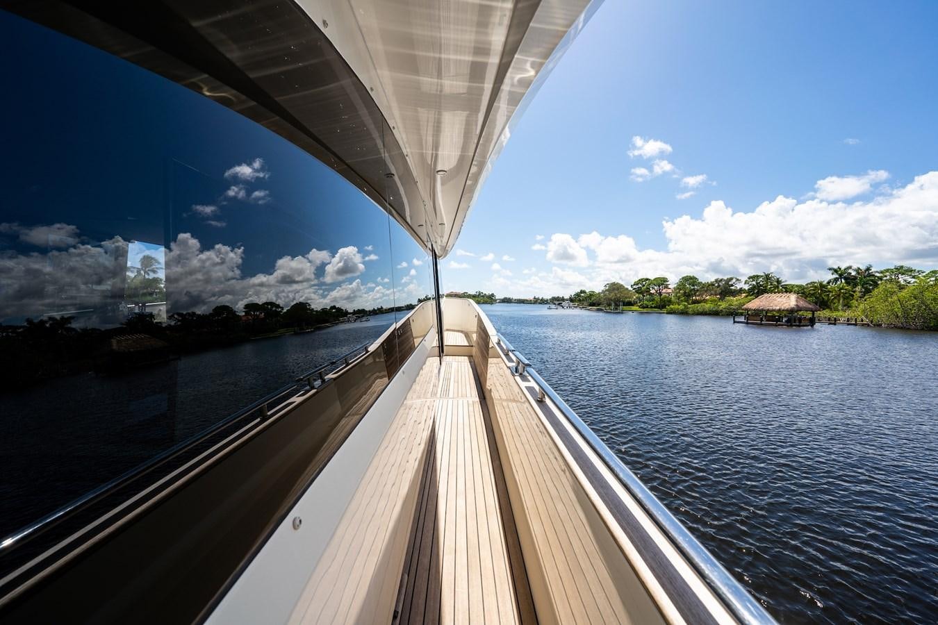 a boat on the water with Sundial Bridge at Turtle Bay in the background aboard NEVER SAY NEVER 2015/2023 Yacht for Sale