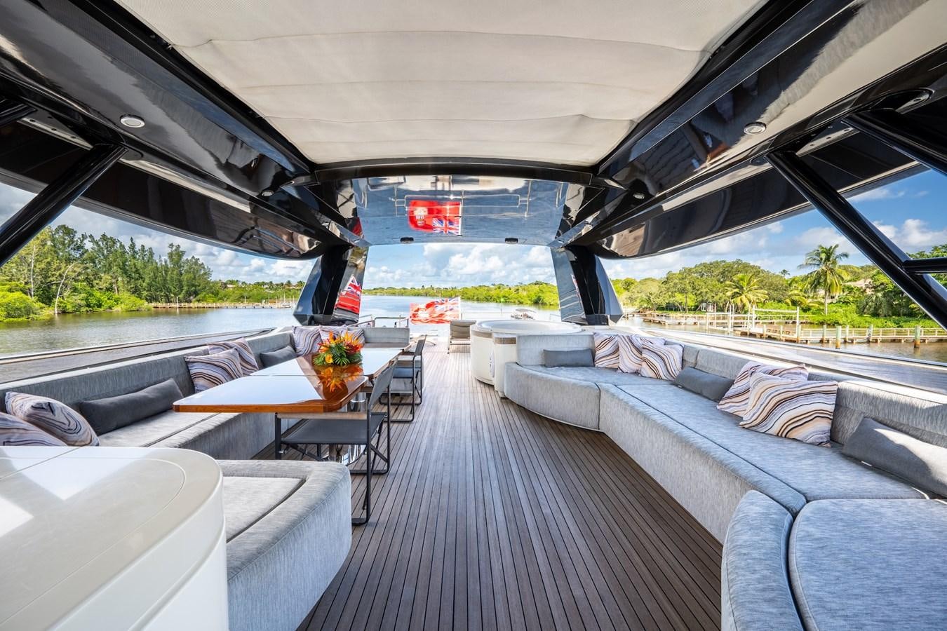 a boat with a table and chairs aboard NEVER SAY NEVER 2015/2023 Yacht for Sale
