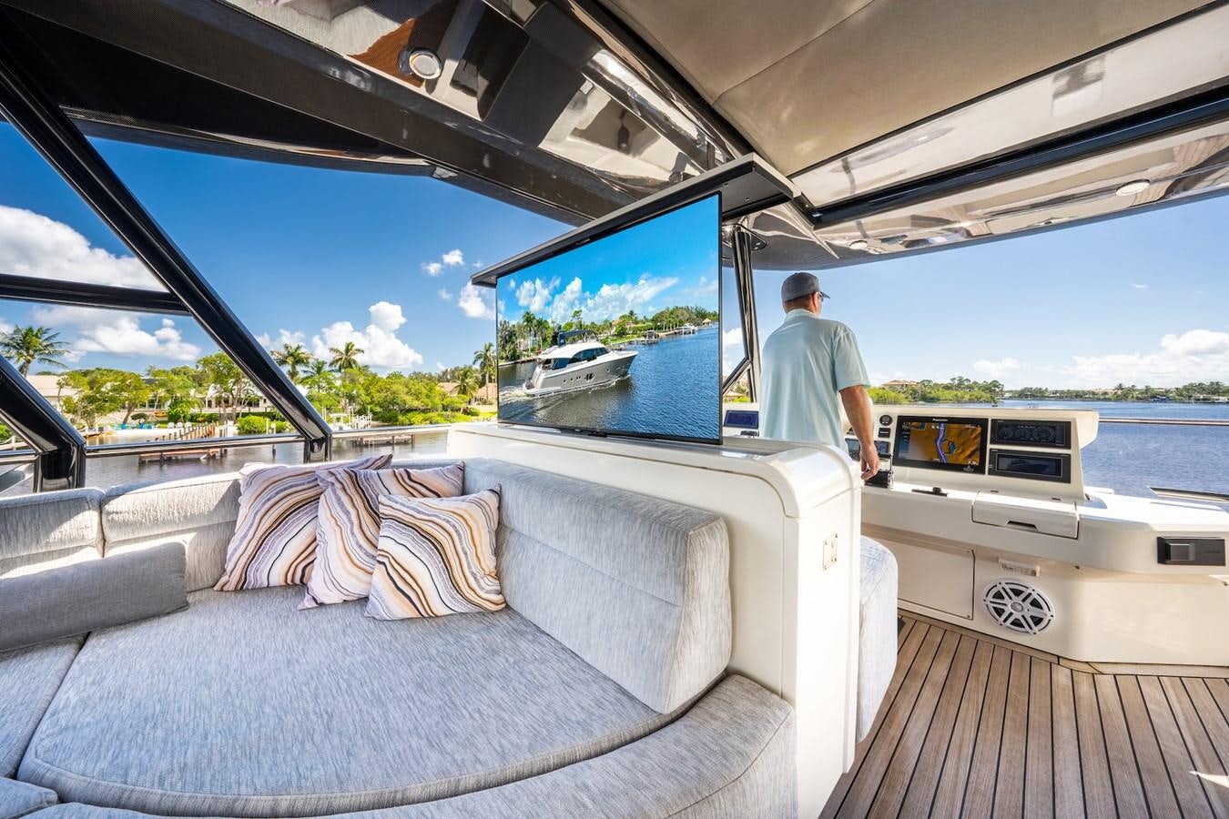 a person standing on a boat aboard NEVER SAY NEVER 2015/2023 Yacht for Sale