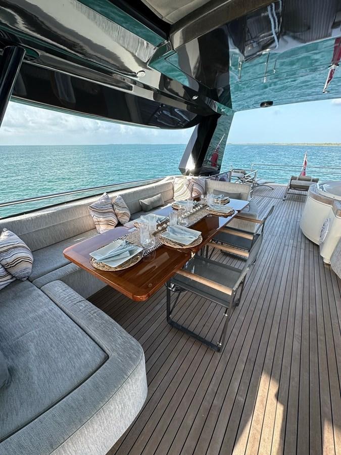 a table on a deck aboard NEVER SAY NEVER 2015/2023 Yacht for Sale