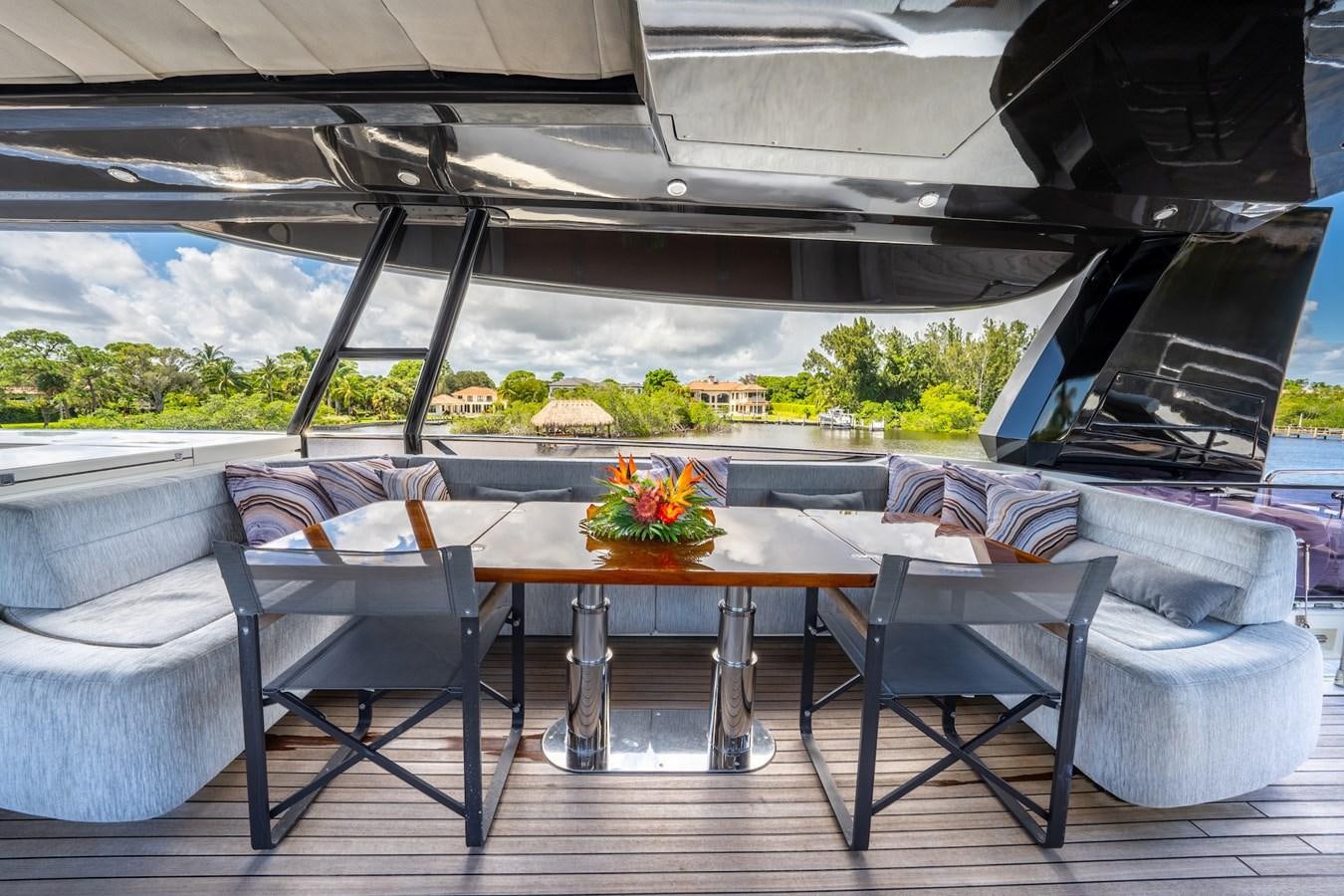 a table and chairs outside aboard NEVER SAY NEVER 2015/2023 Yacht for Sale