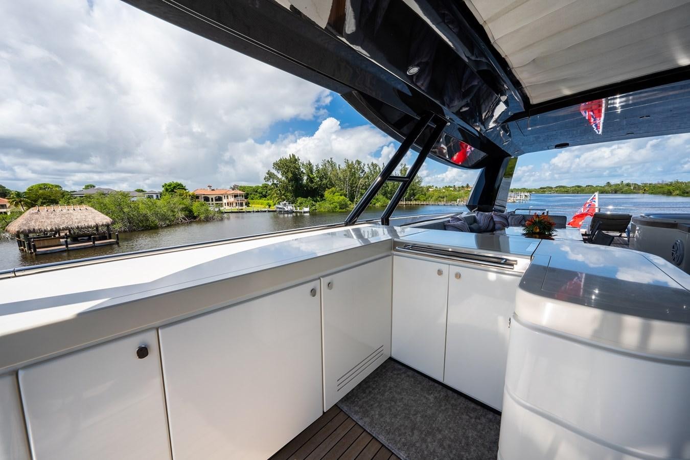a kitchen with white cabinets aboard NEVER SAY NEVER 2015/2023 Yacht for Sale
