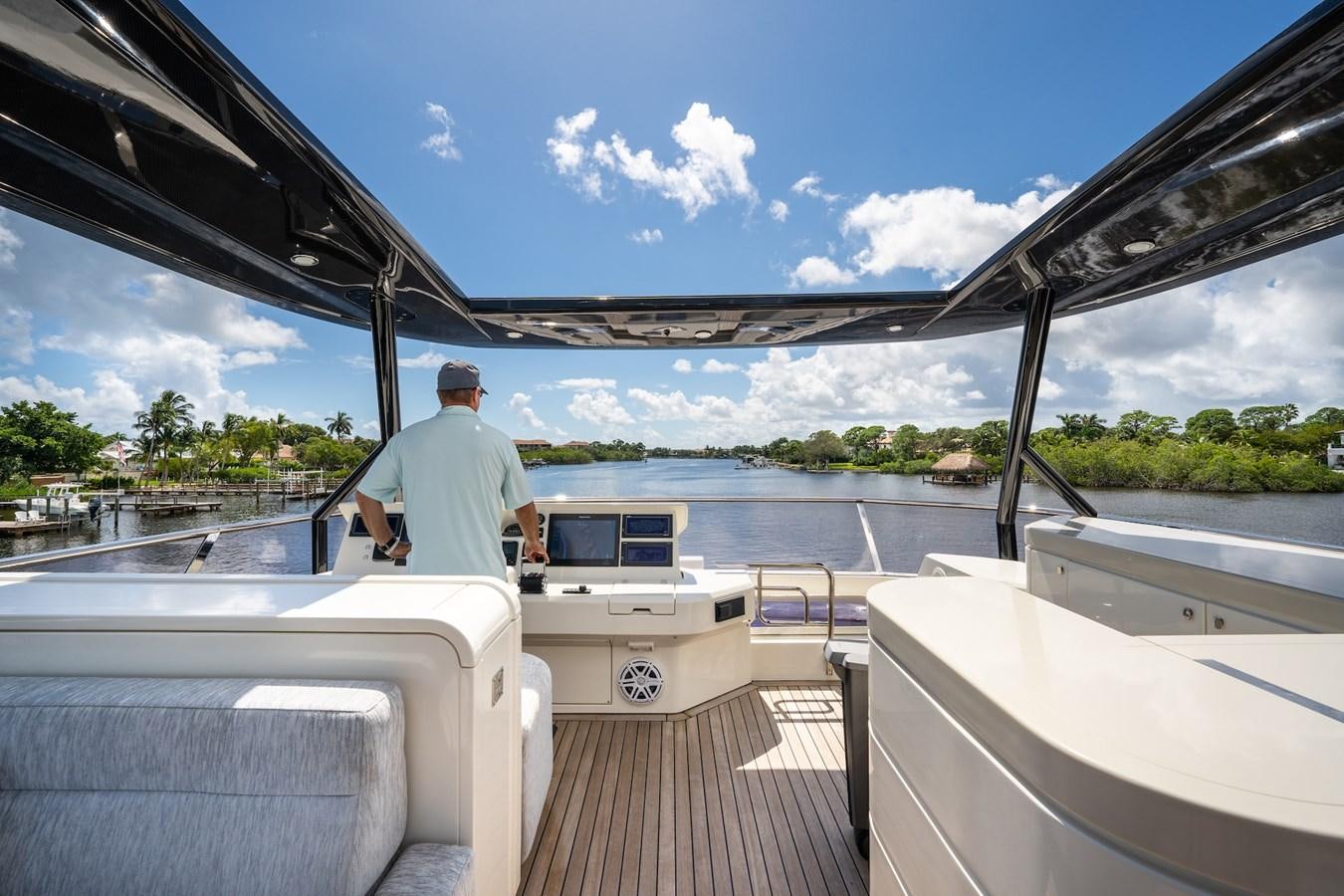 a person standing on a deck looking out over the water aboard NEVER SAY NEVER 2015/2023 Yacht for Sale
