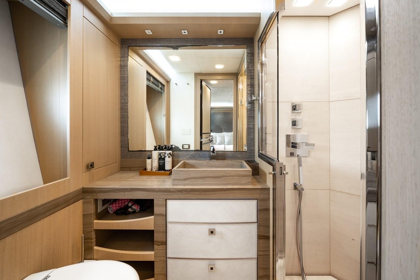 a bathroom with a sink and a mirror aboard NEVER SAY NEVER 2015/2023 Yacht for Sale