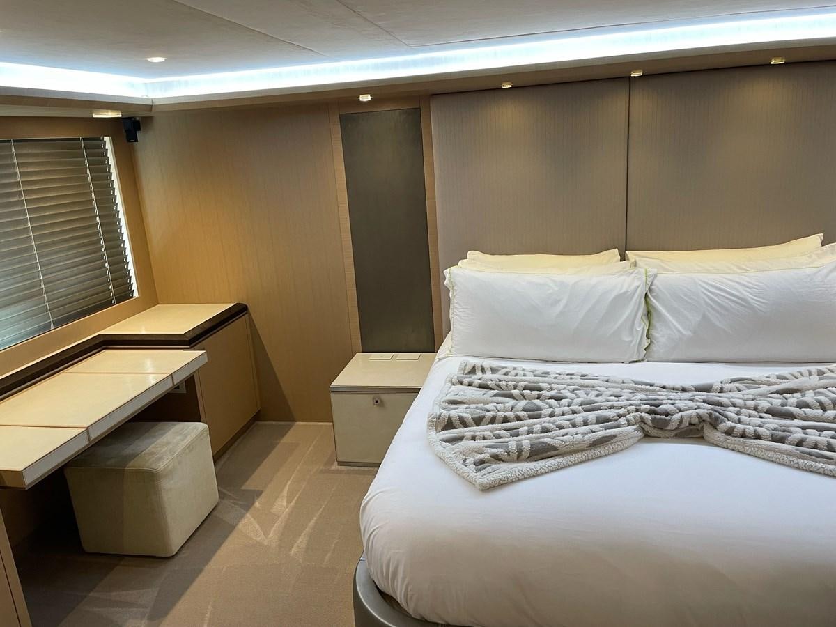 a bed with white sheets aboard NEVER SAY NEVER 2015/2023 Yacht for Sale