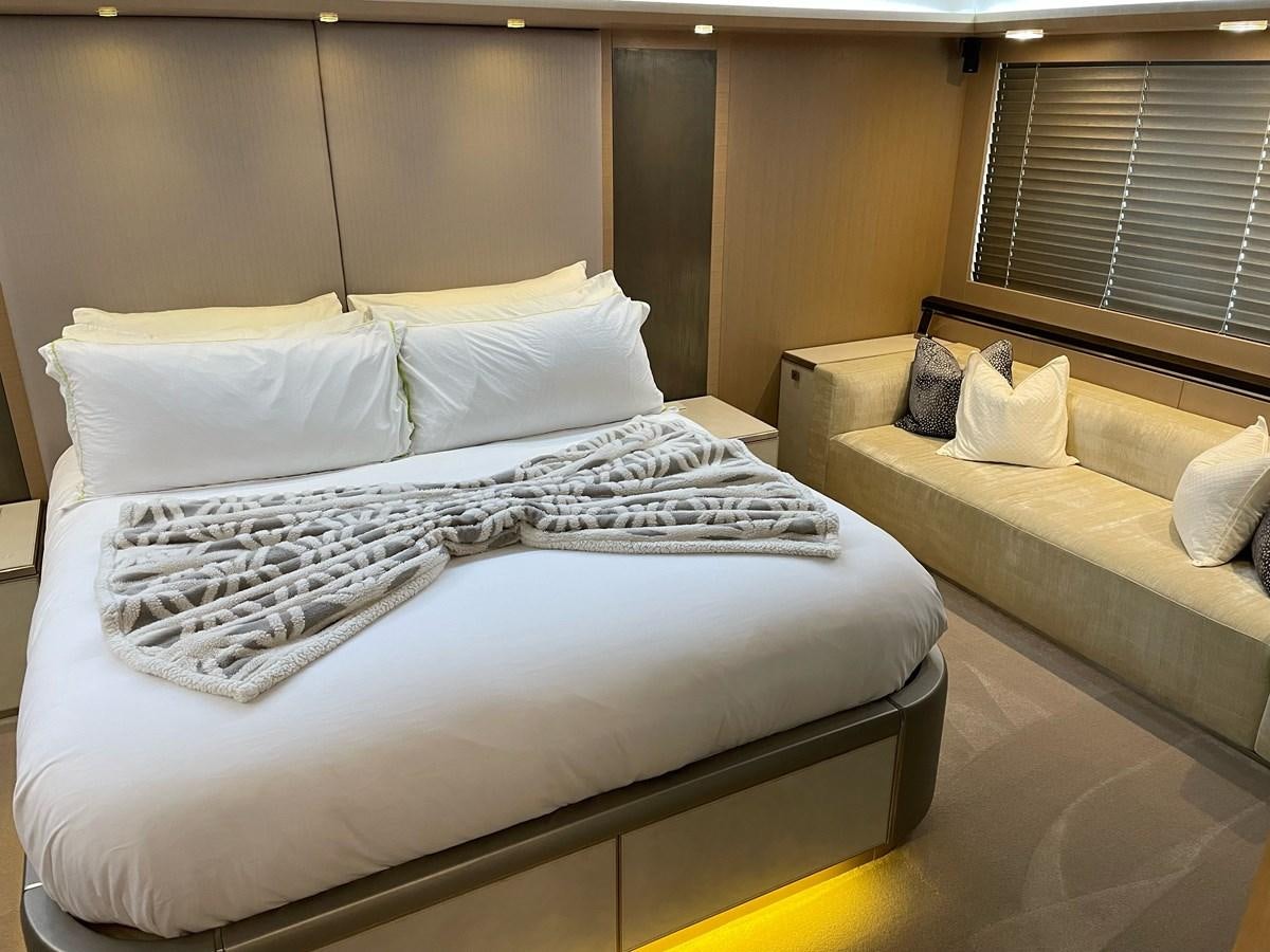a bed with white sheets aboard NEVER SAY NEVER 2015/2023 Yacht for Sale