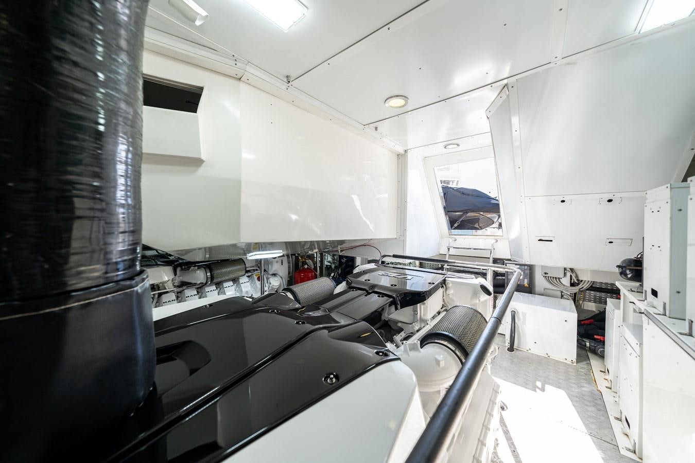a large kitchen with white cabinets aboard NEVER SAY NEVER 2015/2023 Yacht for Sale