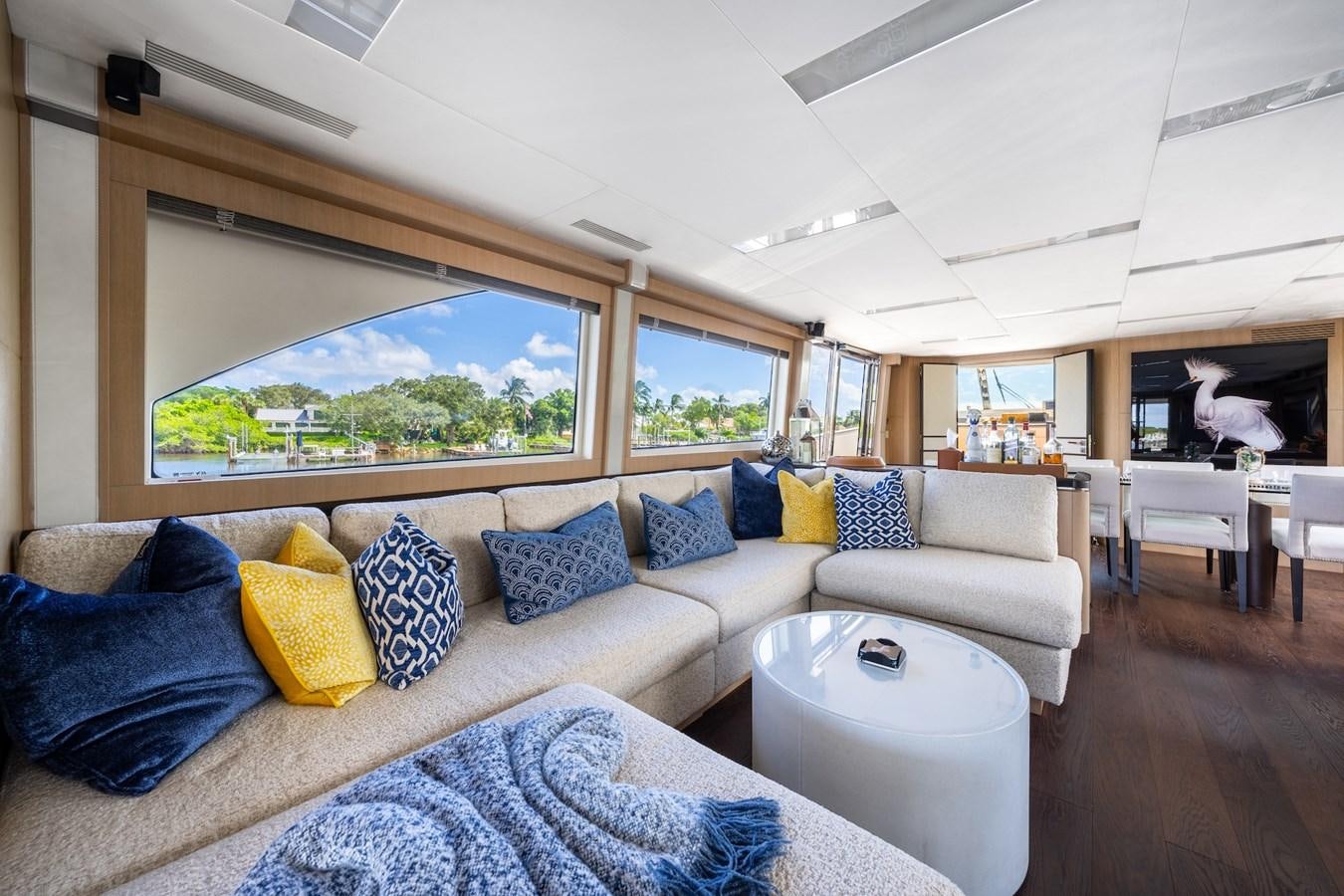 a large living room with a large window aboard NEVER SAY NEVER 2015/2023 Yacht for Sale