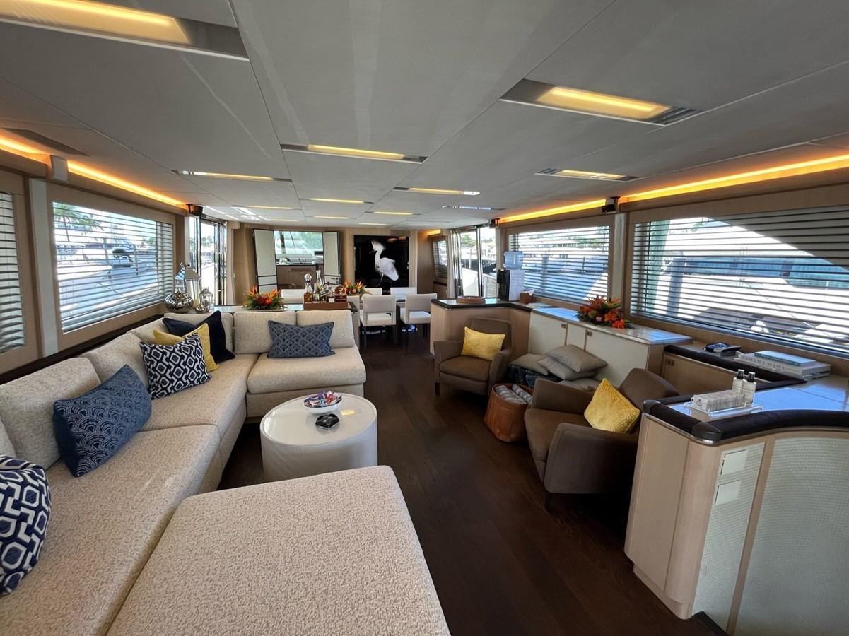 a living room with a large window aboard NEVER SAY NEVER 2015/2023 Yacht for Sale