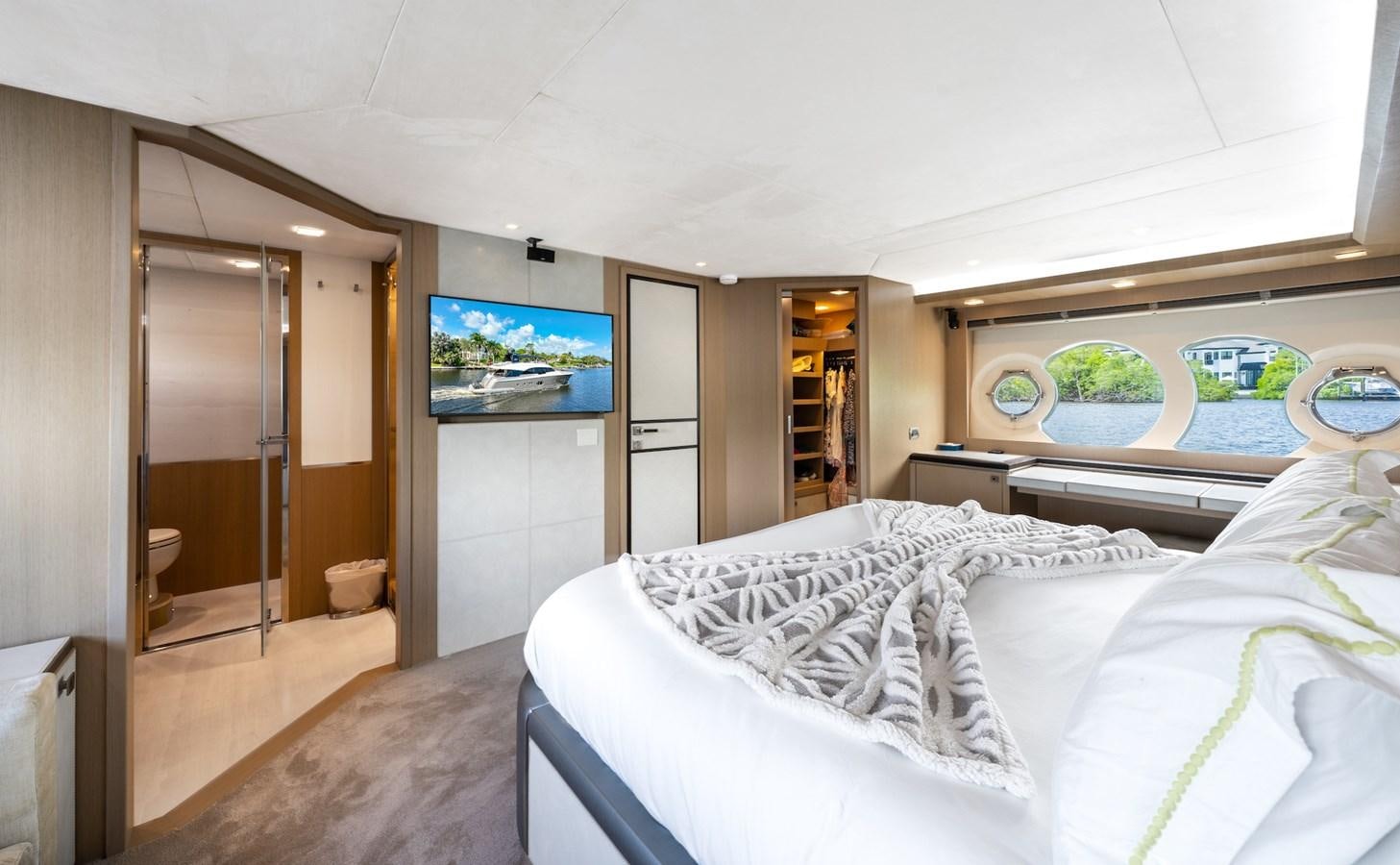 a bedroom with a bed and a television aboard NEVER SAY NEVER 2015/2023 Yacht for Sale