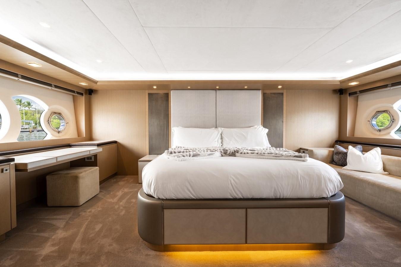 a room with a bed and a desk aboard NEVER SAY NEVER 2015/2023 Yacht for Sale