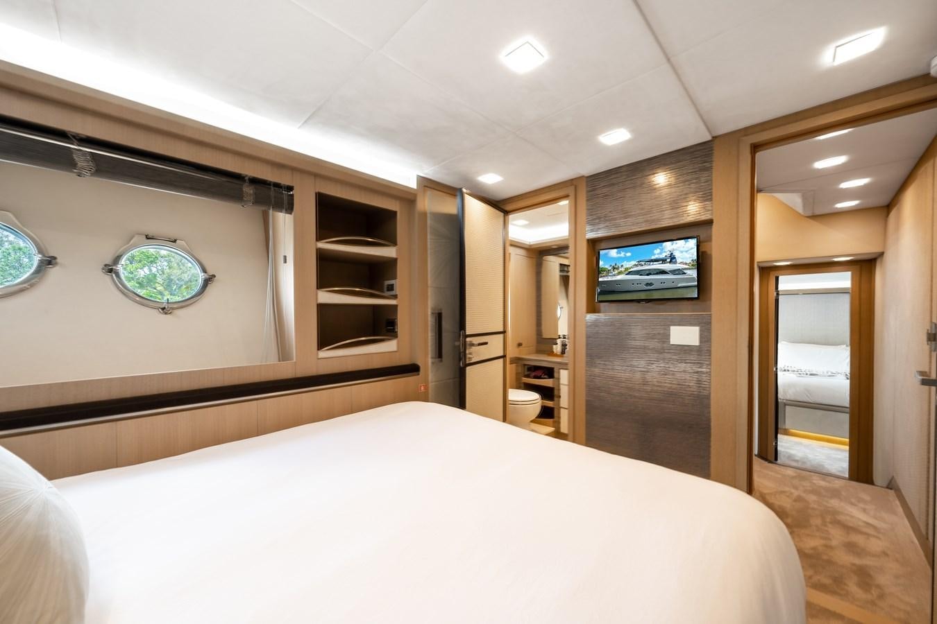 a bedroom with a large bed aboard NEVER SAY NEVER 2015/2023 Yacht for Sale