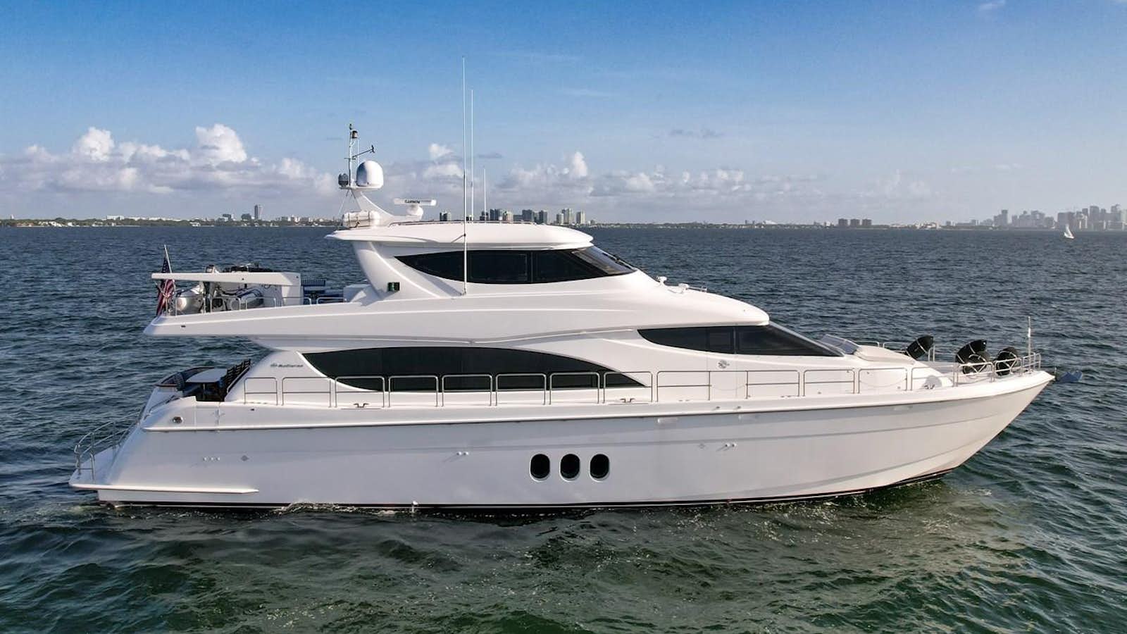 a white yacht in the water aboard HATTERAS 80 MOTOR Yacht for Sale