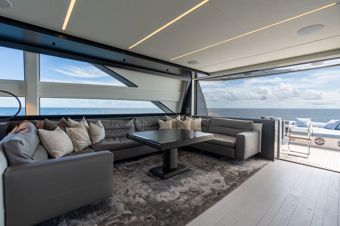 a living room with a large window aboard VINTAGE Yacht for Sale