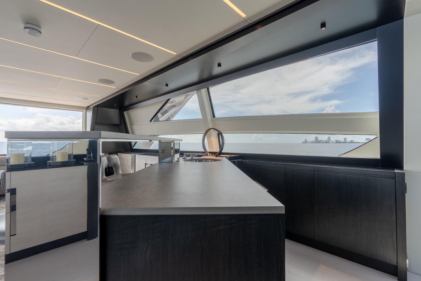 a room with a table and a window aboard VINTAGE Yacht for Sale