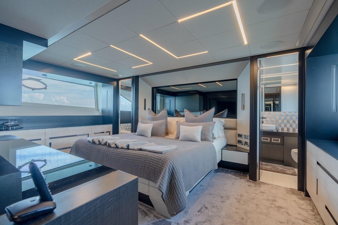 a room with a bed and a desk aboard VINTAGE Yacht for Sale