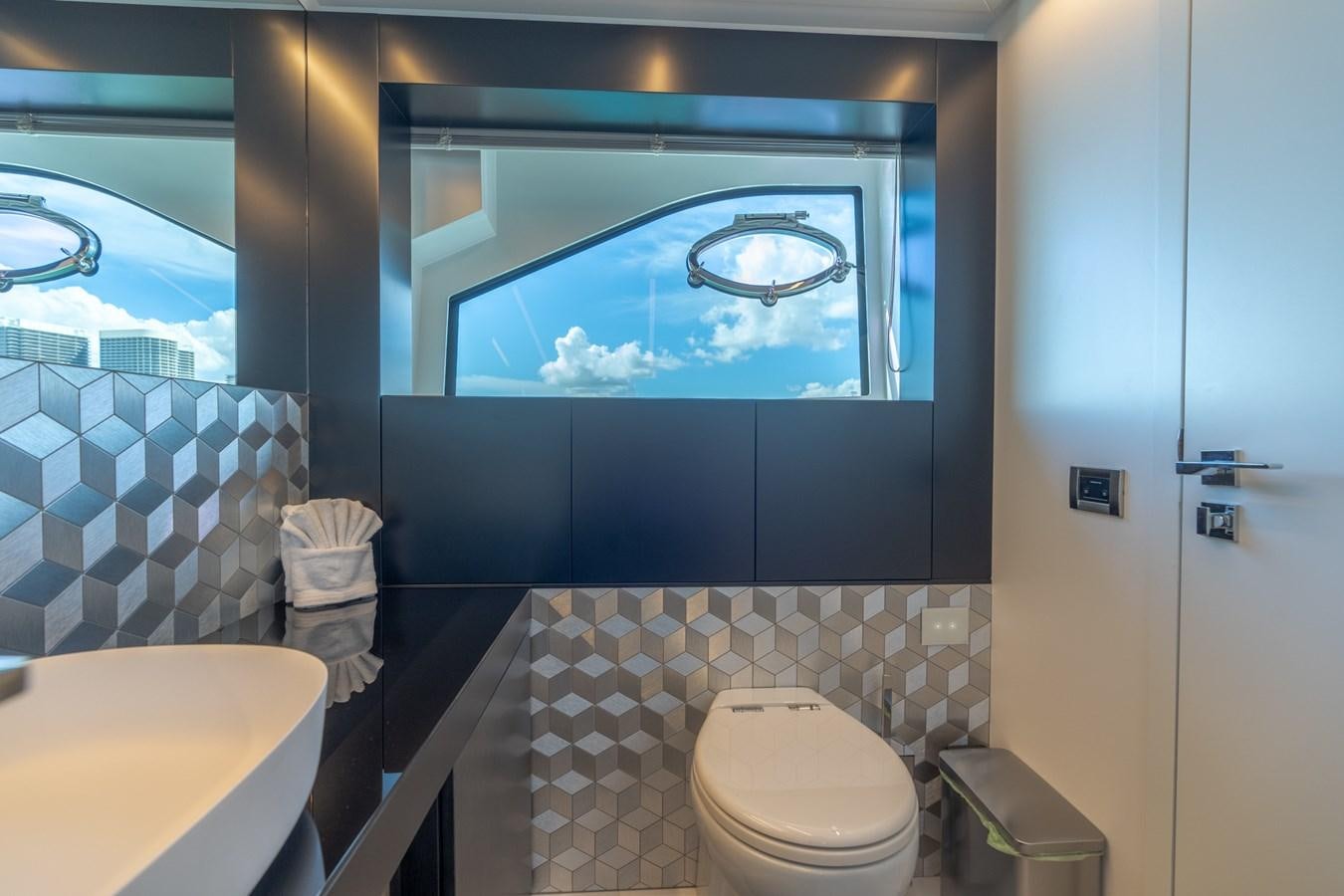 a bathroom with a blue wall aboard VINTAGE Yacht for Sale