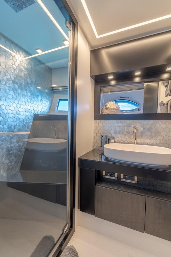 a bathroom with a large mirror aboard VINTAGE Yacht for Sale