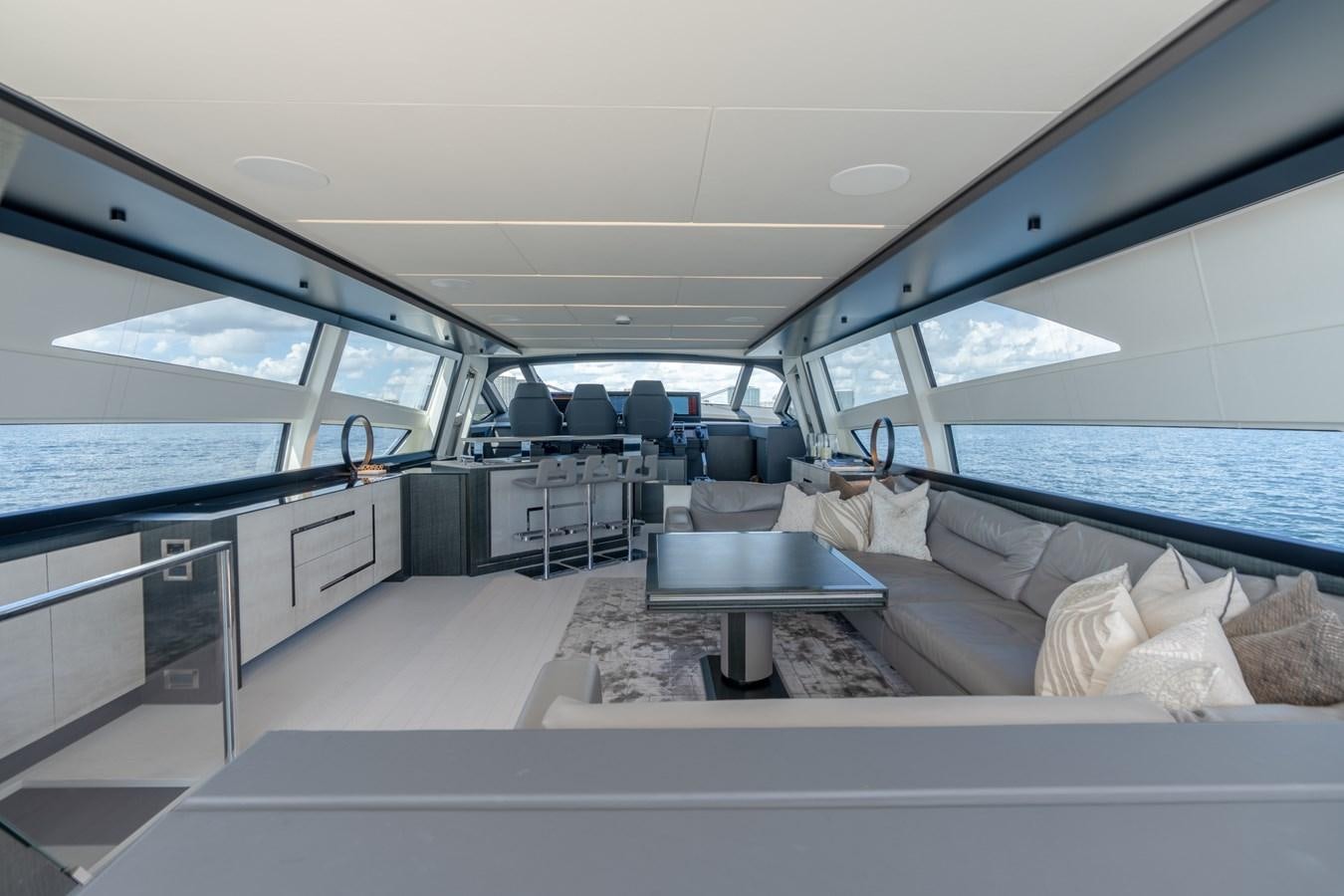 a boat with a table and a couch aboard VINTAGE Yacht for Sale