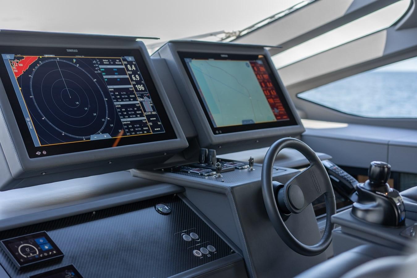 a car with a screen and buttons aboard VINTAGE Yacht for Sale