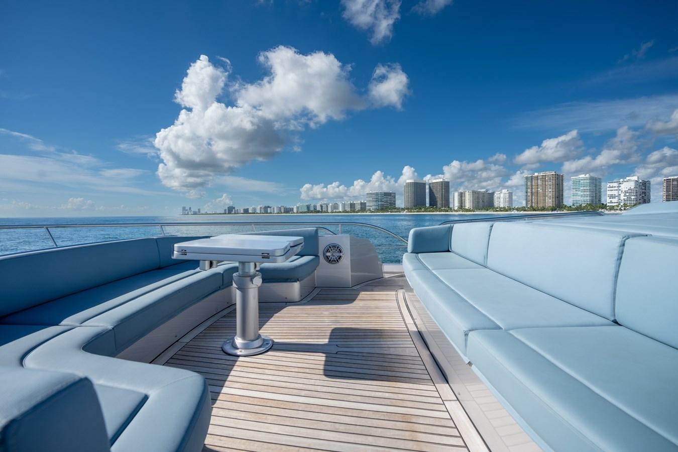 a deck with a view of a city and water below aboard VINTAGE Yacht for Sale