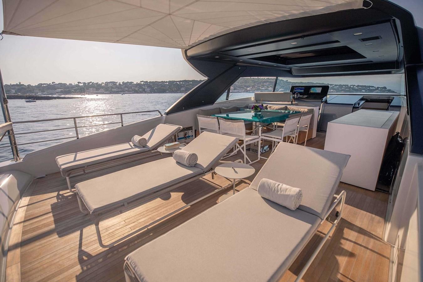 a room with a table and chairs aboard 2019 SANLORENZO SX76 #16 Yacht for Sale