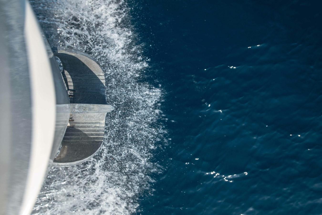 a plane flying over a body of water aboard 2019 SANLORENZO SX76 #16 Yacht for Sale