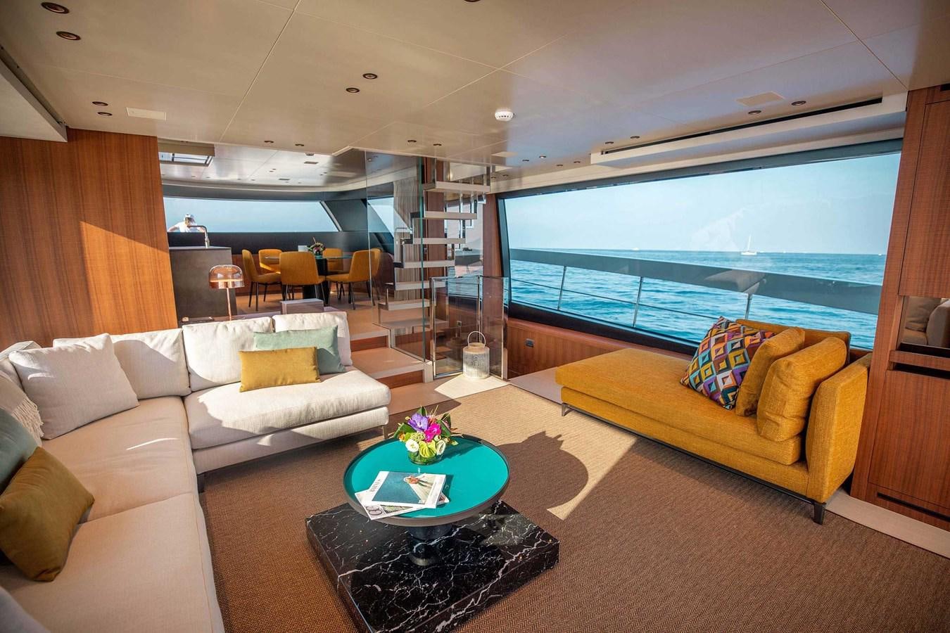 a living room with a large window aboard 2019 SANLORENZO SX76 #16 Yacht for Sale