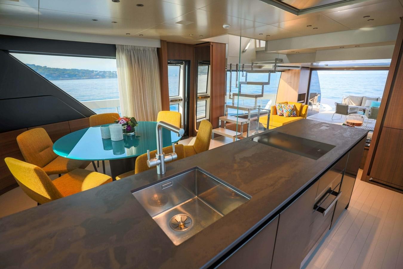 a kitchen with a large island aboard 2019 SANLORENZO SX76 #16 Yacht for Sale