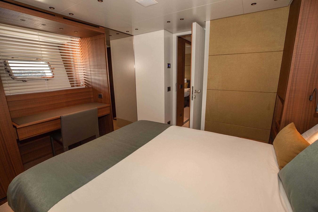 a room with a bed and a window aboard 2019 SANLORENZO SX76 #16 Yacht for Sale