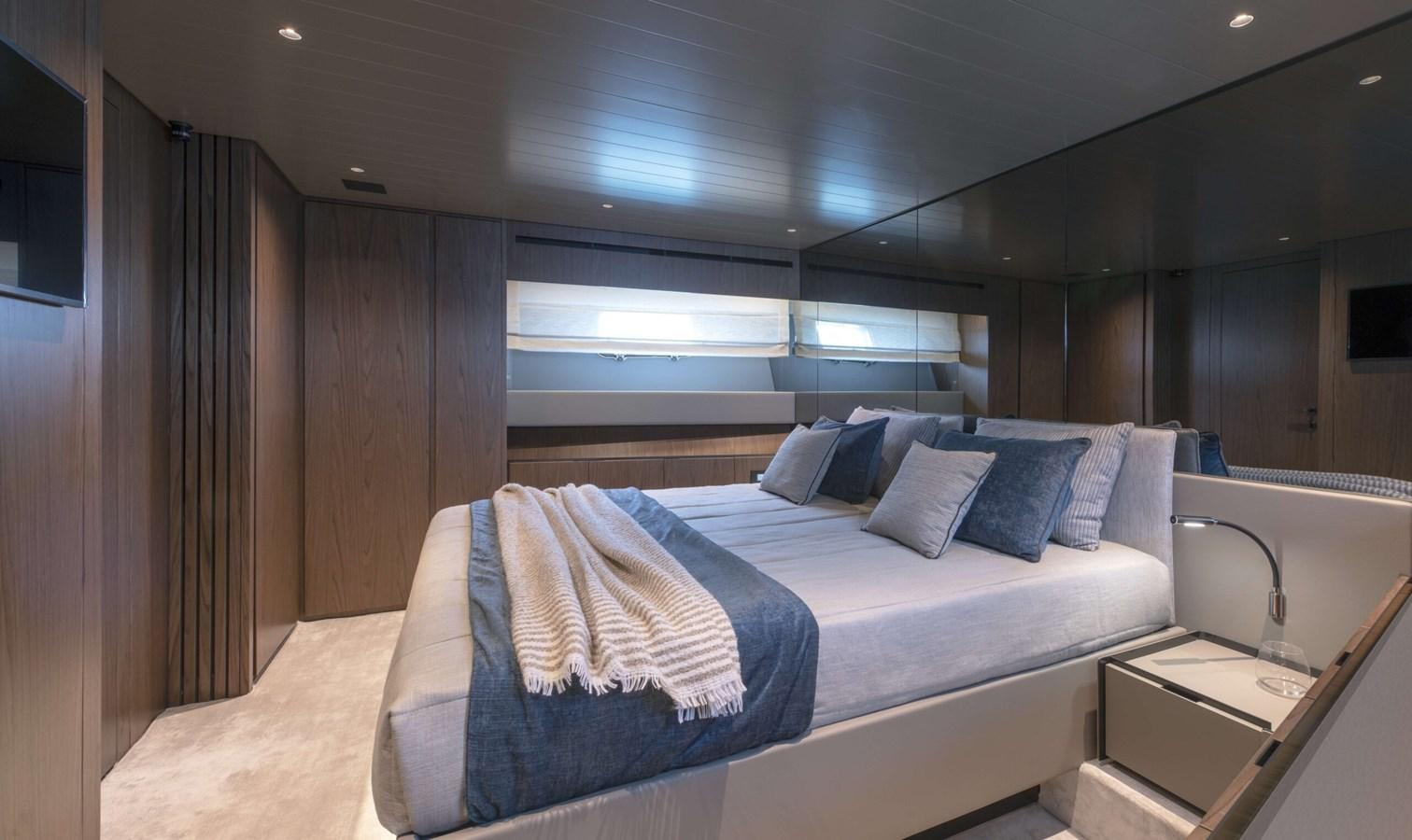 a bed in a room aboard 2024  BLUEGAME BG72/BG74 Yacht for Sale