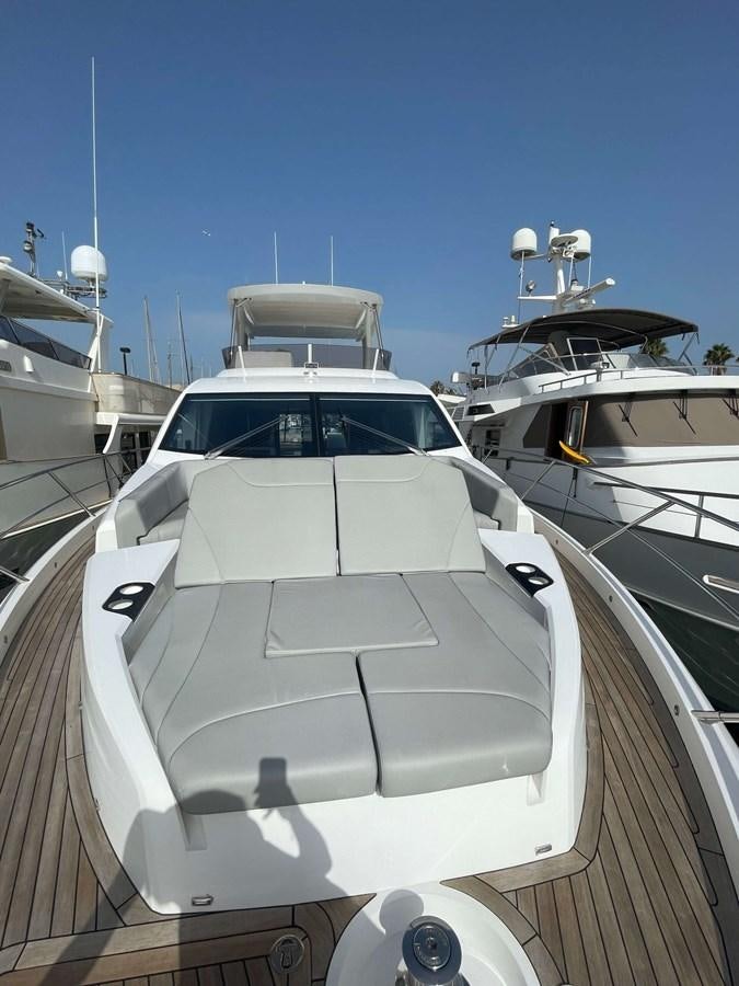 a white yacht on the water aboard SUNSEEKER 70' MANHATTAN Yacht for Sale