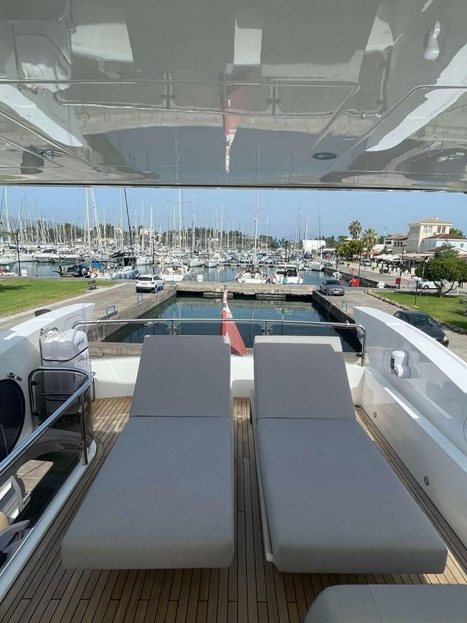 looking out of a window at a city and water below aboard SUNSEEKER 70' MANHATTAN Yacht for Sale