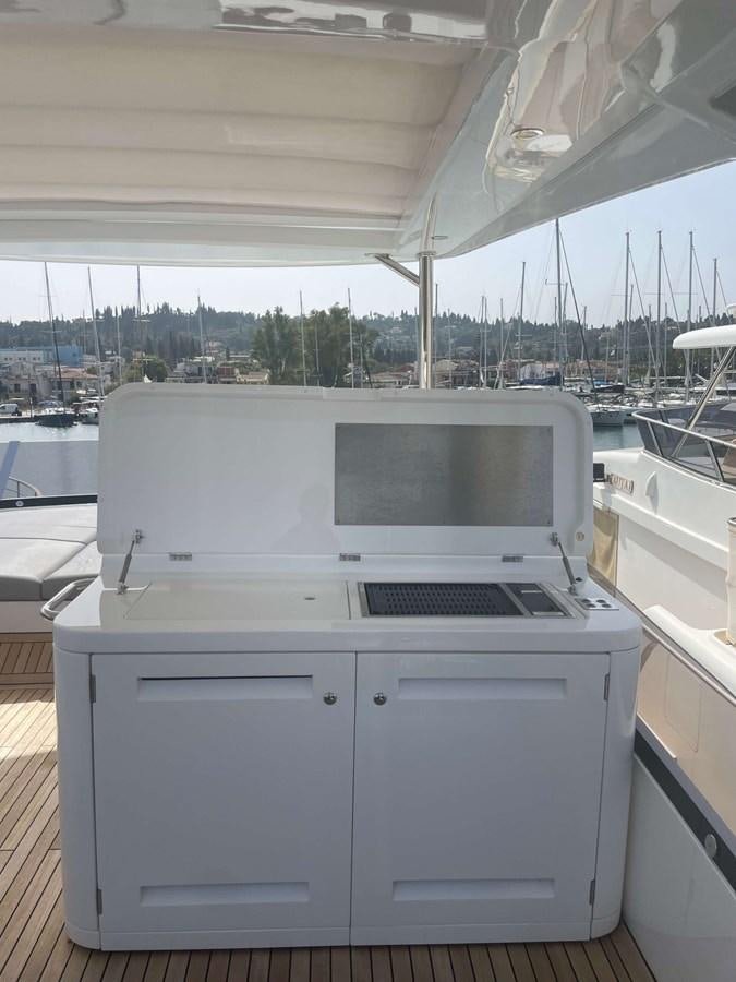 a couple of laptops on a table aboard SUNSEEKER 70' MANHATTAN Yacht for Sale