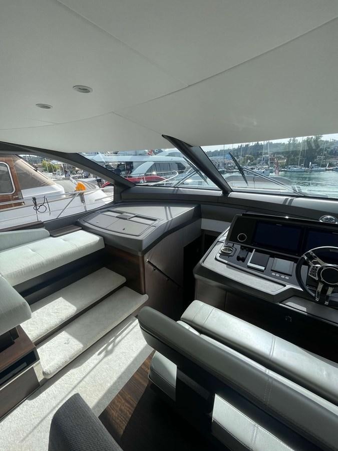 inside of a car aboard SUNSEEKER 70' MANHATTAN Yacht for Sale