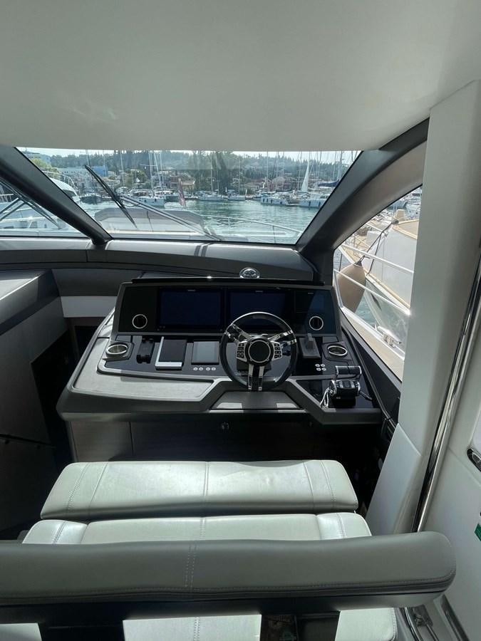inside of a car aboard SUNSEEKER 70' MANHATTAN Yacht for Sale