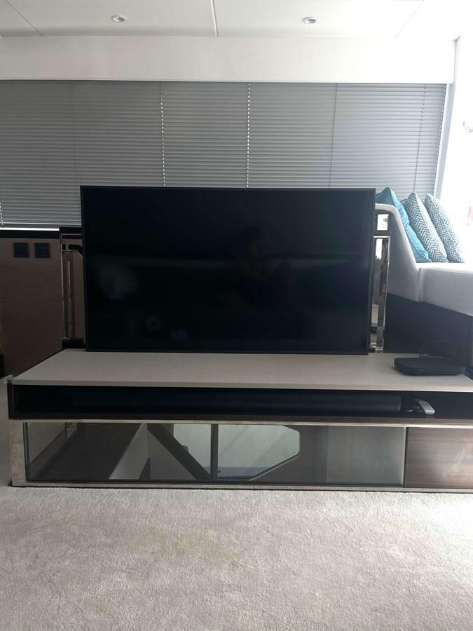 a tv on a table aboard SUNSEEKER 70' MANHATTAN Yacht for Sale