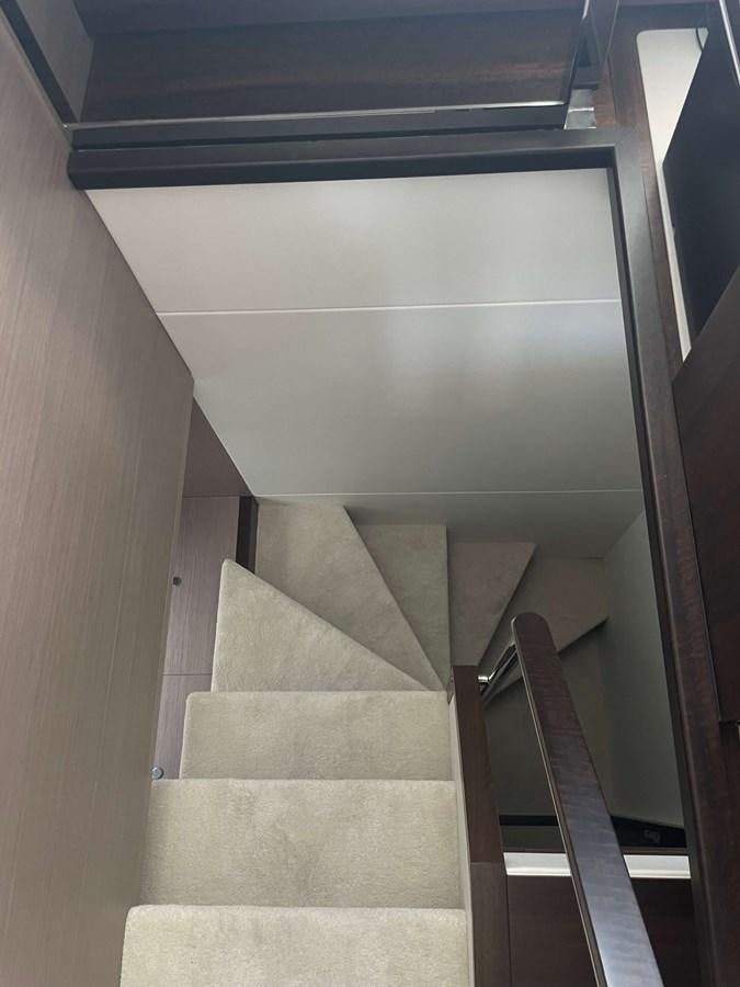 a staircase with a metal railing aboard SUNSEEKER 70' MANHATTAN Yacht for Sale
