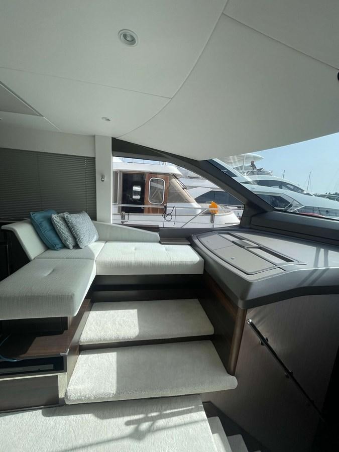 a room with a bed and a desk aboard SUNSEEKER 70' MANHATTAN Yacht for Sale