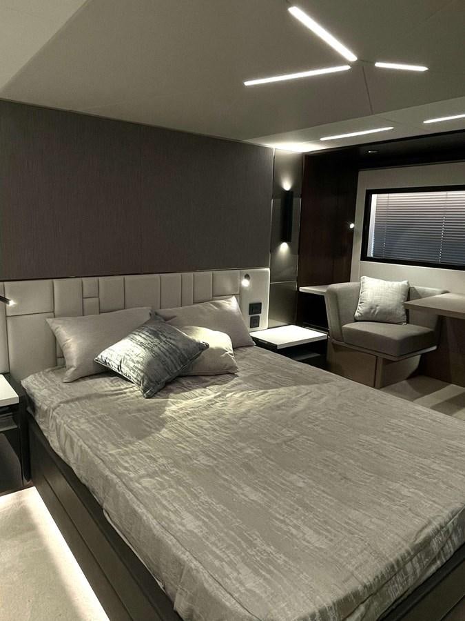a hotel room with a bed and a chair aboard SUNSEEKER 70' MANHATTAN Yacht for Sale