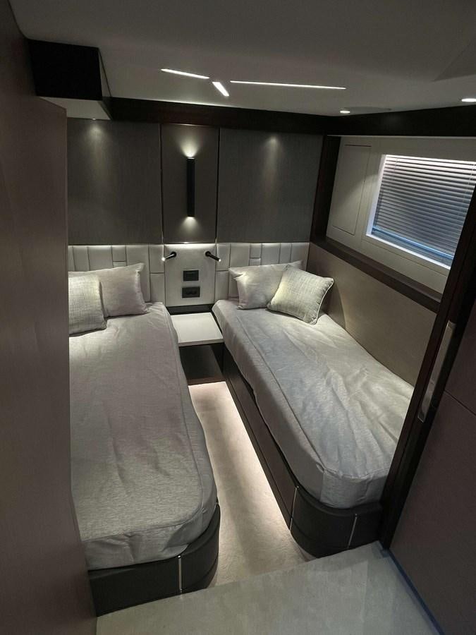 a room with two beds aboard SUNSEEKER 70' MANHATTAN Yacht for Sale