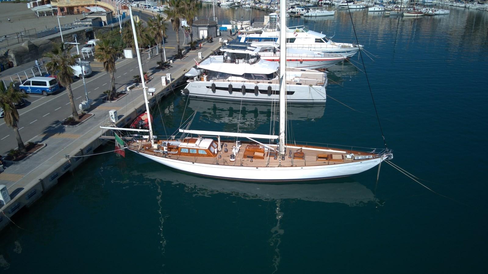 a group of boats docked at a pier aboard WINDIGO Yacht for Sale