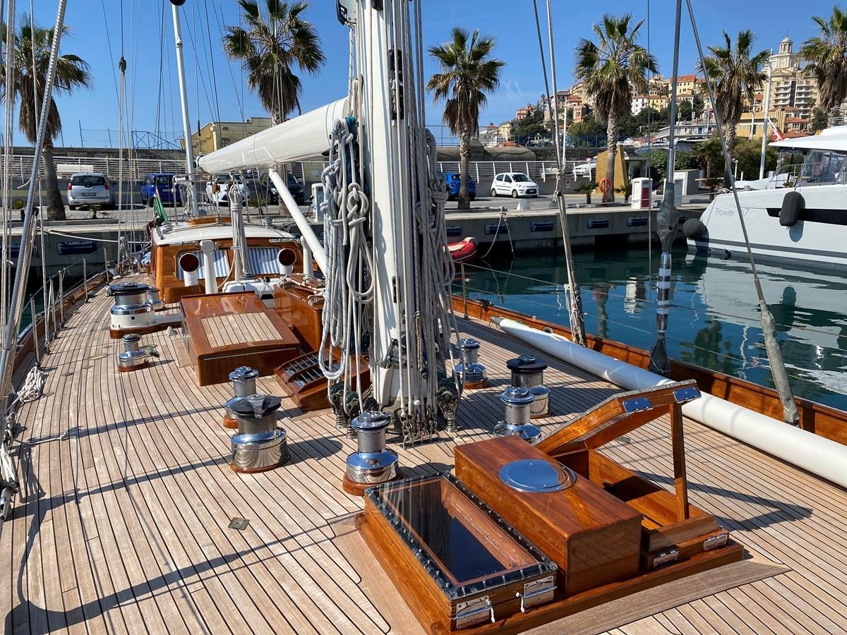 a sailboat docked at a pier aboard WINDIGO Yacht for Sale