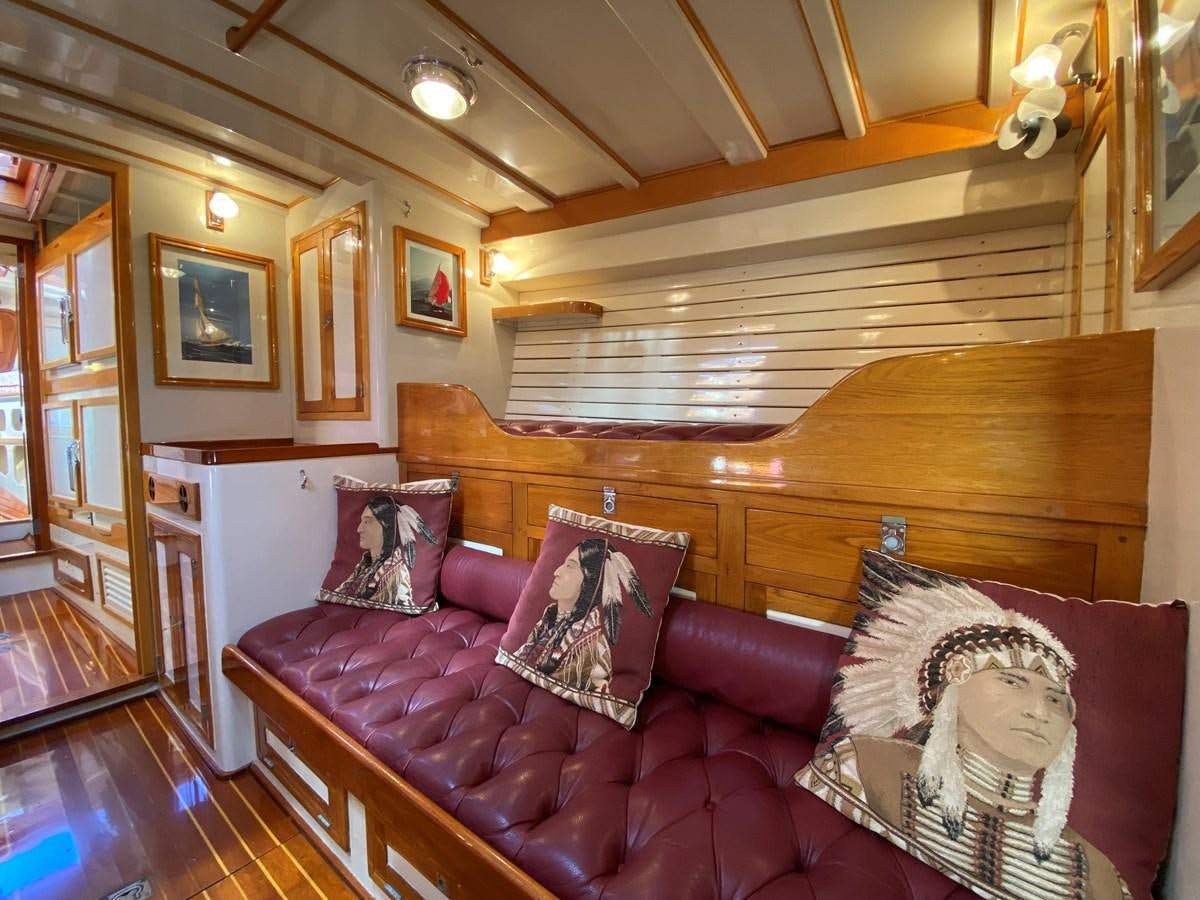 a living room with a couch aboard WINDIGO Yacht for Sale