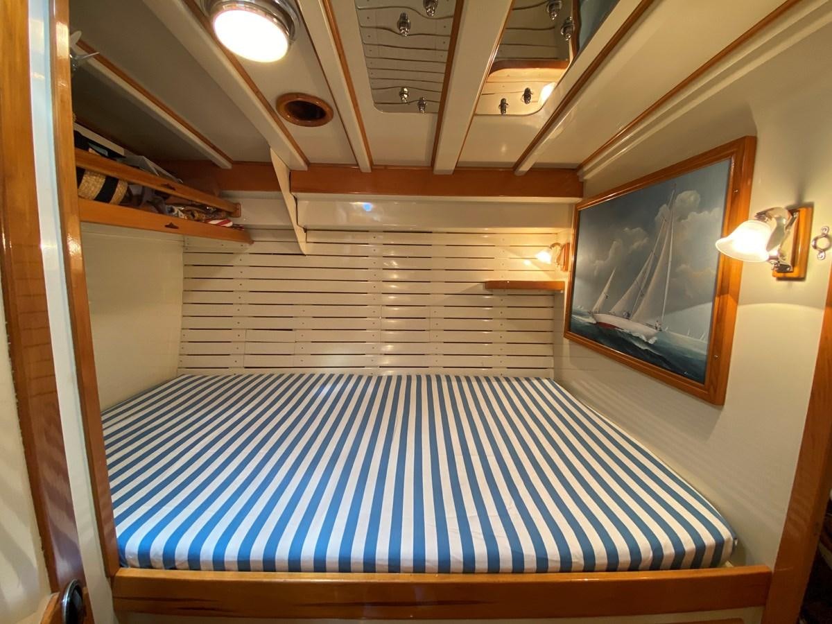 a bed in a room aboard WINDIGO Yacht for Sale