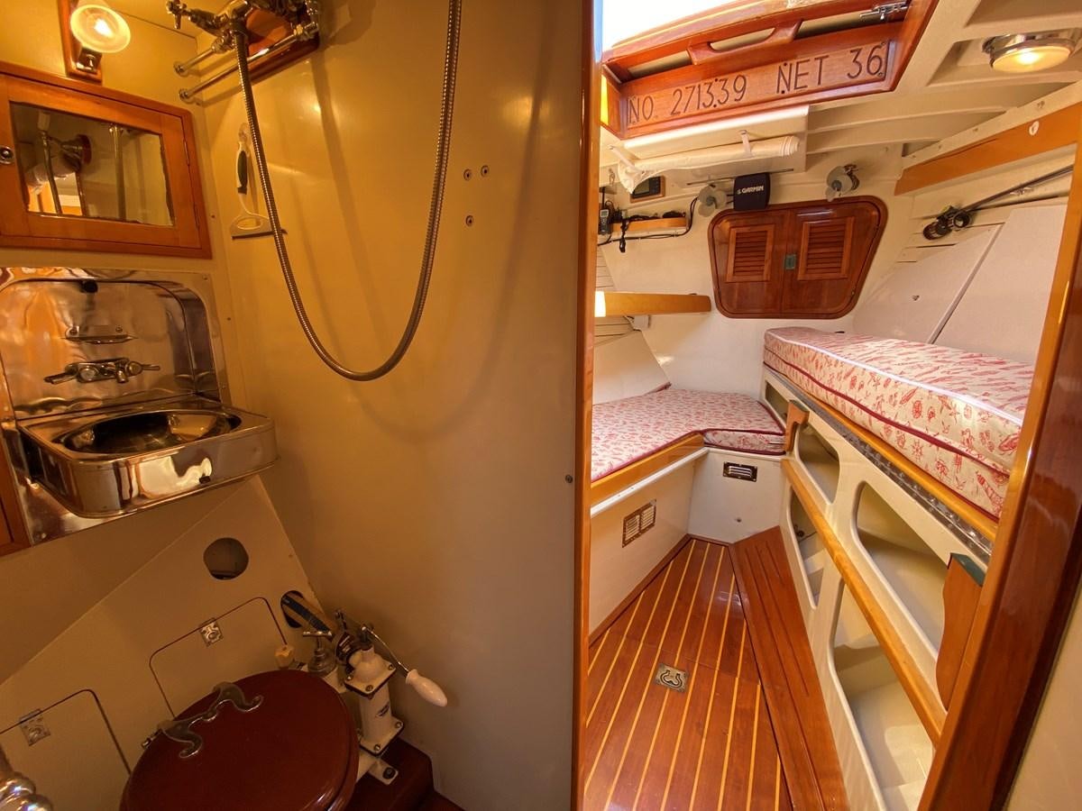 a kitchen with a sink and a stove aboard WINDIGO Yacht for Sale