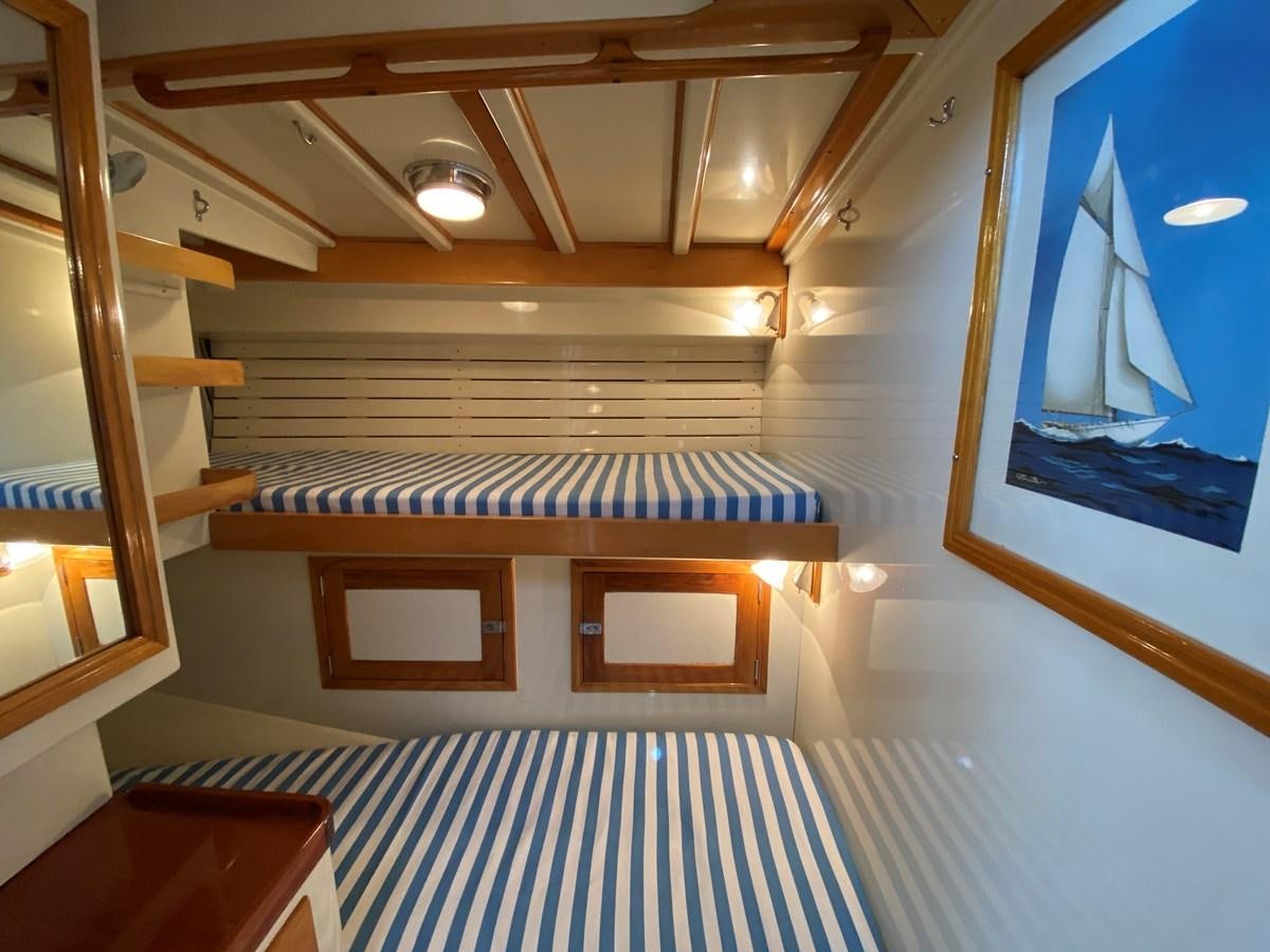 a room with bunk beds aboard WINDIGO Yacht for Sale