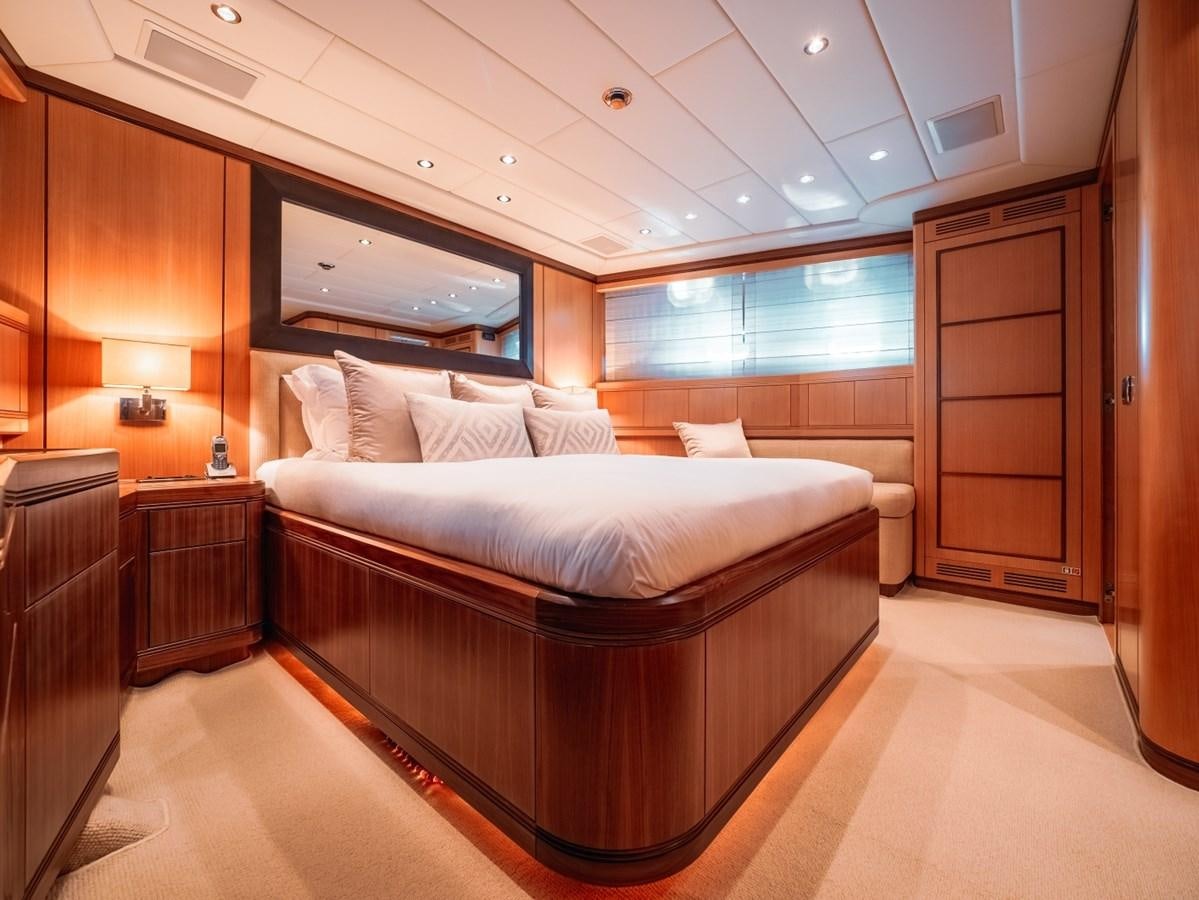 a room with a bed and a tv aboard WET PANTHER Yacht for Sale